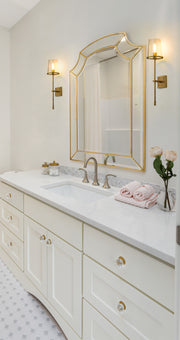 Callista 1 Light 6.5" Wall Sconce, 26" Tall in Rubbed Brass in a room setting