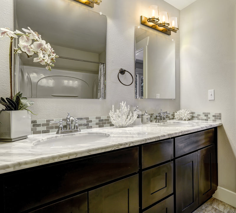 Callista 3 Light 27.5" Vanity in Rubbed Brass in a room setting