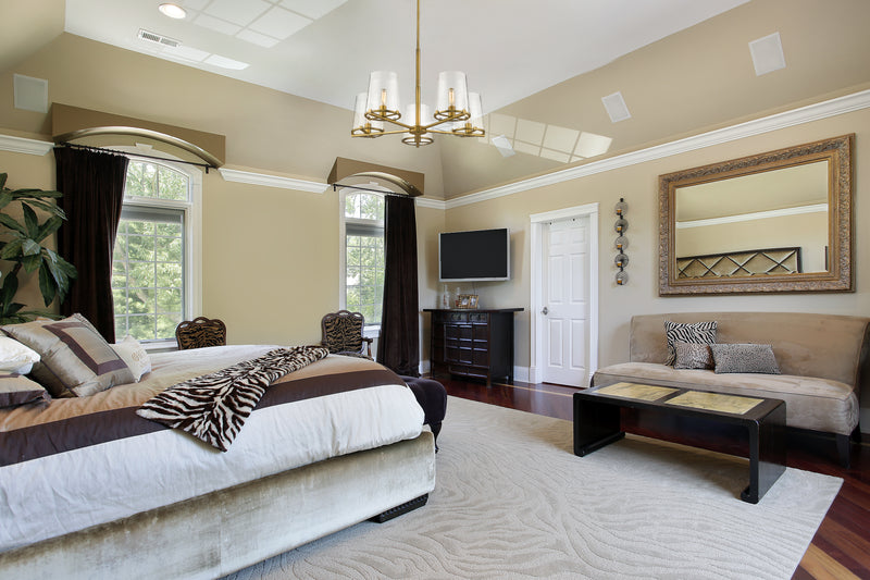 Callista 5 Light 33" Chandelier in Rubbed Brass in a room setting