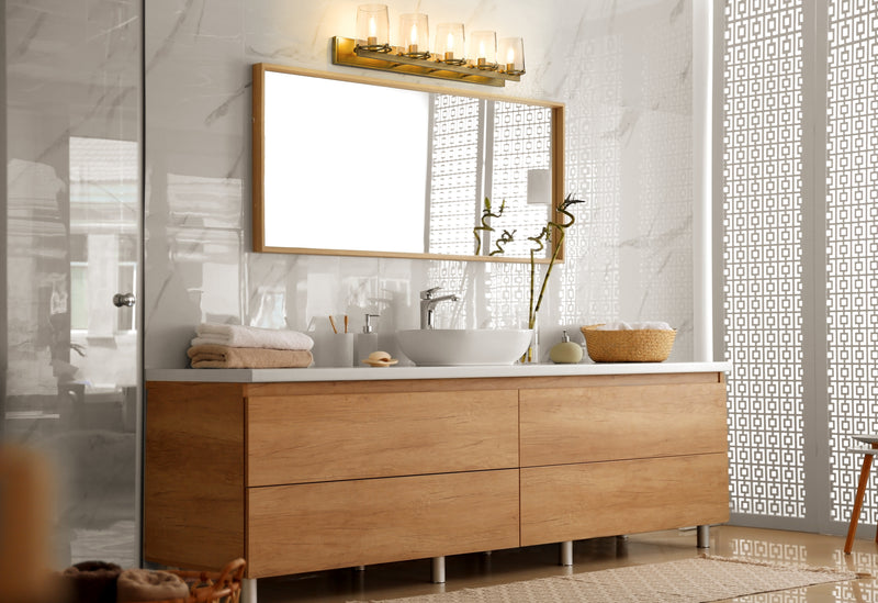 Callista 5 Light 47" Vanity in Rubbed Brass in a room setting