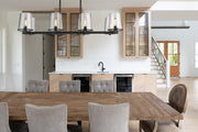 Callista 8 Light 56" Linear Pendant in Matte Black in a room setting