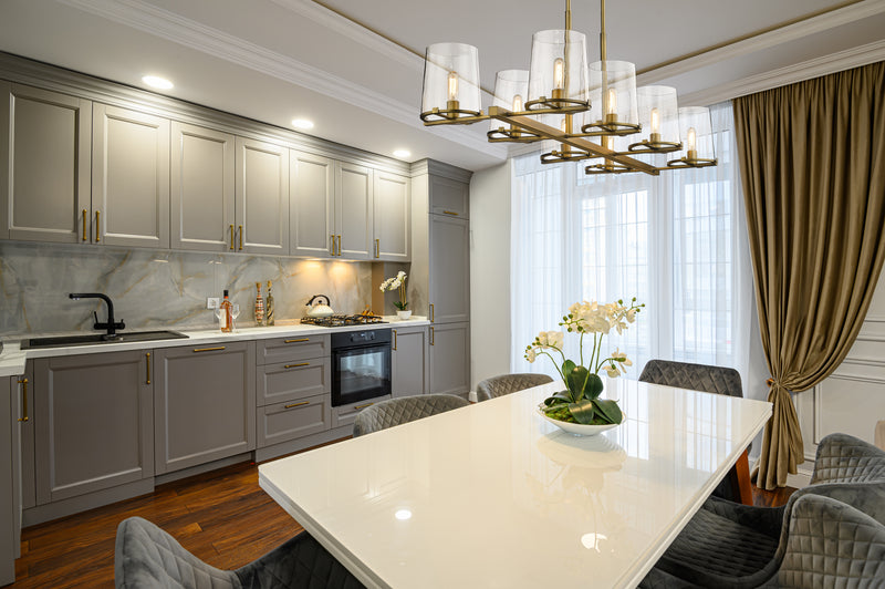 Callista 8 Light 56" Linear Pendant in Rubbed Brass in a room setting
