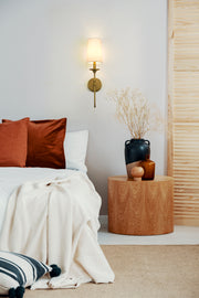 Emily 1 Light 5.5" Wall Sconce, 24" Tall in Rubbed Brass in a room setting