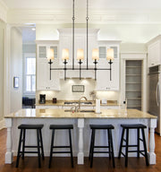 Emily 5 Light 51" Linear Pendant in Matte Black in a room setting