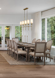 Emily 5 Light 51" Linear Pendant in Rubbed Brass in a room setting