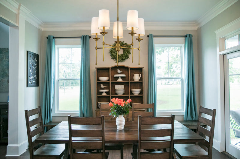 Emily 5 Light 28" Chandelier in Rubbed Brass in a room setting