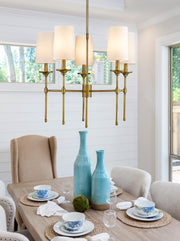 Emily 5 Light 28" Chandelier in Rubbed Brass in a room setting