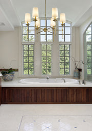 Emily 6 Light 38" Chandelier in Rubbed Brass in a room setting