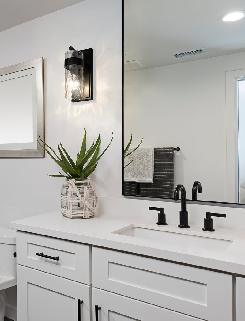 Fontaine 1 Light 4.75" Wall Sconce in Matte Black in a room setting