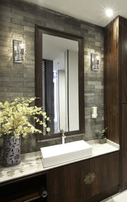 Fontaine 1 Light 4.75" Wall Sconce in Polished Nickel in a room setting