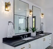 Fontaine 1 Light 4.75" Wall Sconce in Rubbed Brass in a room setting