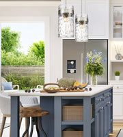 Fontaine 4 Light 13" Pendant in Brushed Nickel in a room setting