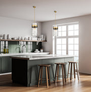 Fontaine 4 Light 13" Pendant in Rubbed Brass in a room setting