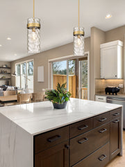 Fontaine 1 Light 6.5" Pendant in Rubbed Brass in a room setting