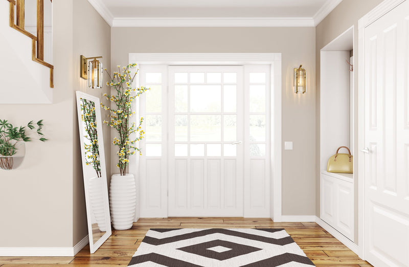 Alverton 1 Light 5.25" Wall Sconce in Rubbed Brass in a room setting