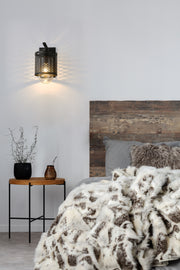 Kipton 1 Light 6" Wall Sconce in Matte Black in a room setting