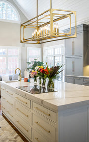 Easton 13 Light 54" Linear Pendant in Rubbed Brass in a room setting