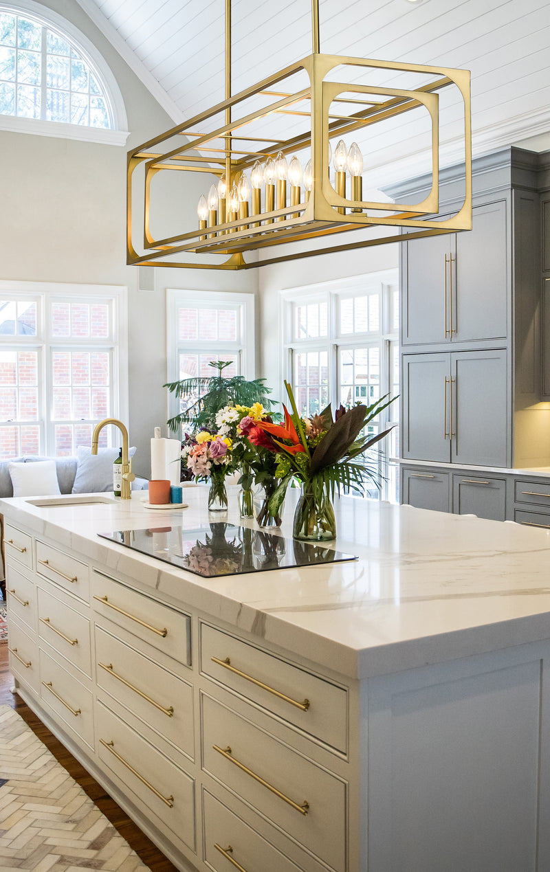 Easton 13 Light 54" Linear Pendant in Rubbed Brass in a room setting