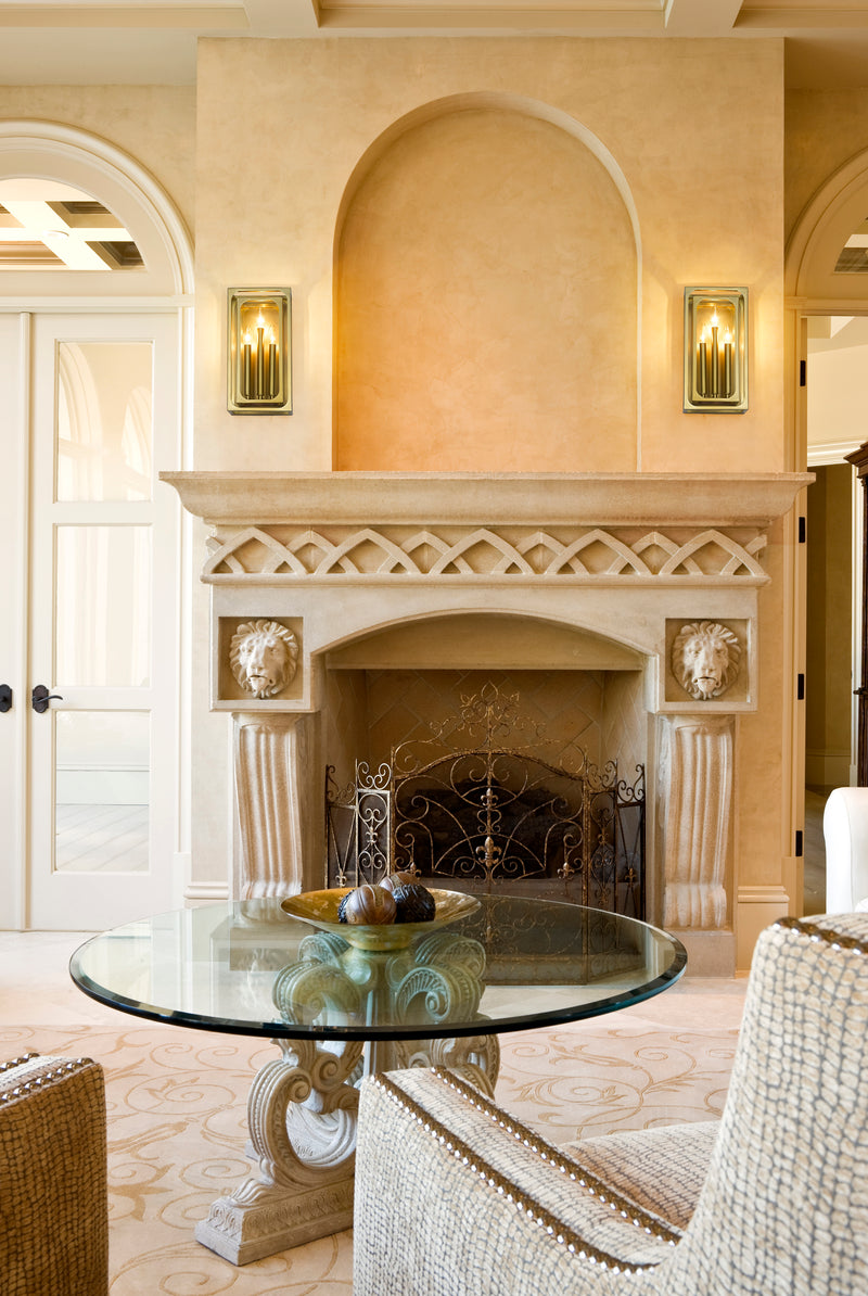 Easton 3 Light 8" Wall Sconce in Rubbed Brass in a room setting
