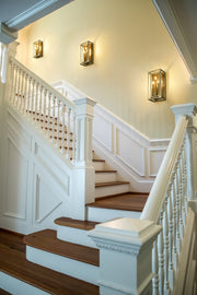 Easton 3 Light 8" Wall Sconce in Rubbed Brass in a room setting