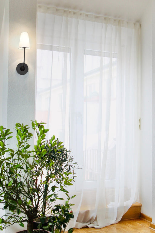 Shannon 1 Light 5.25" Wall Sconce in Matte Black in a room setting