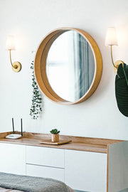 Shannon 1 Light 5.25" Wall Sconce in Rubbed Brass in a room setting