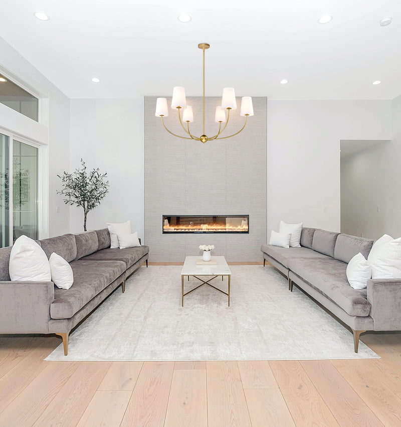 Shannon 6 Light 42" Chandelier in Rubbed Brass in a room setting