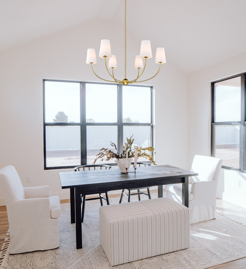 Shannon 6 Light 42" Chandelier in Rubbed Brass in a room setting