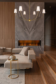 Shannon 6 Light 62" Chandelier in Rubbed Brass in a room setting