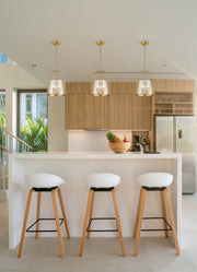 Archis 3 Light 12" Pendant in Modern Gold in a room setting