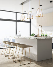 Archis 5 Light 18" Pendant in Modern Gold in a room setting