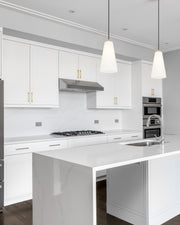 Farrell 1 Light 6" Pendant, Cord Mount in Modern Gold in a room setting