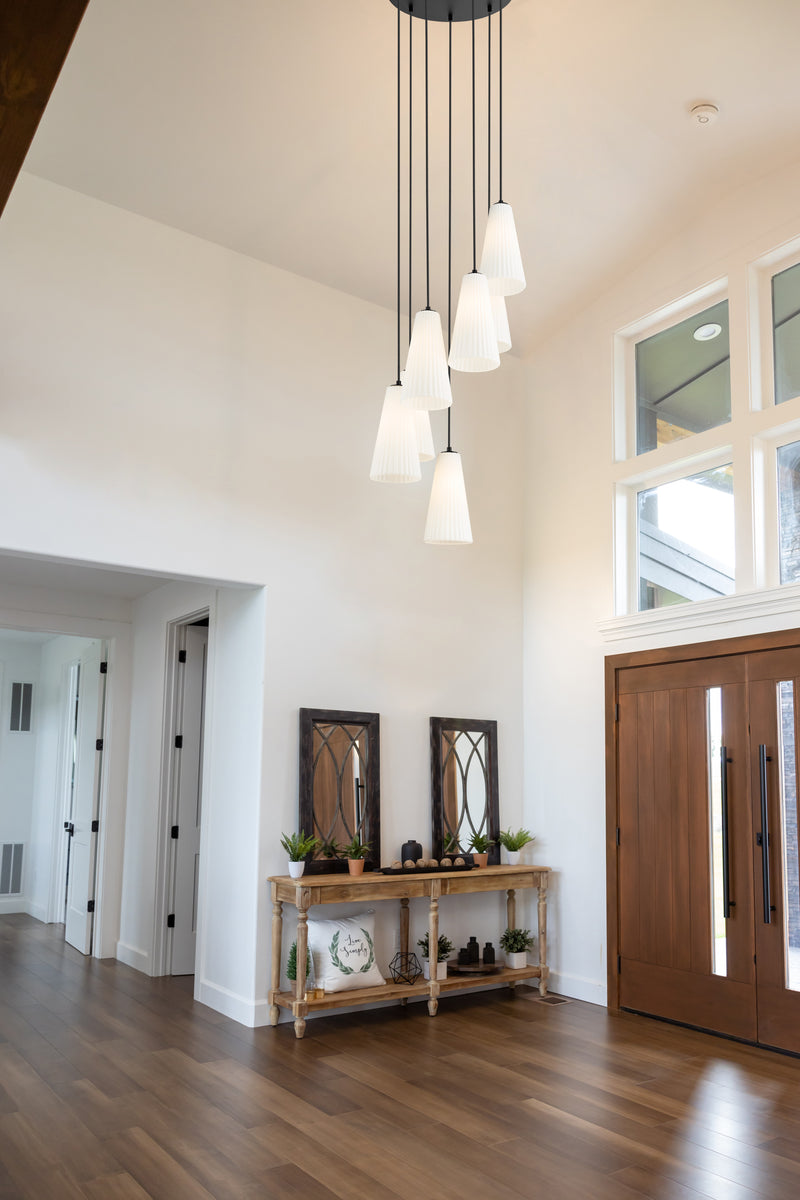 Farrell 7 Light 18" Pendant, 13.75" Tall in Matte Black in a room setting