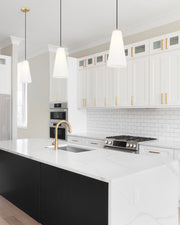 Farrell 1 Light 7.25" Pendant, Cord Mount in Modern Gold in a room setting