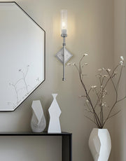 Esme 1 Light 6.75" Wall Sconce in Brushed Nickel in a room setting