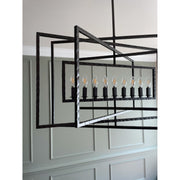 Capri 9 Light 39" Chandelier in Raw Steel in a room setting