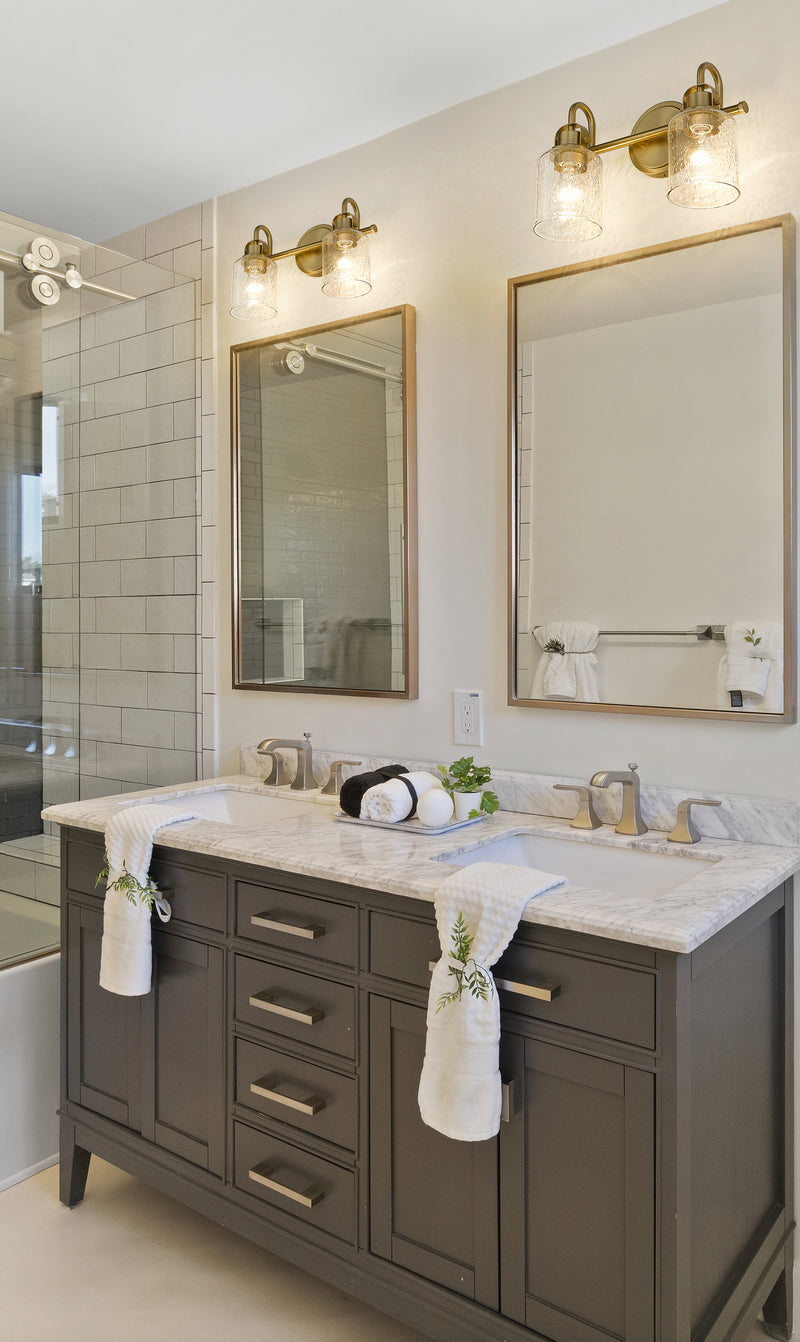 Kinsley 2 Light 14.5" Vanity in Heirloom Gold in a room setting