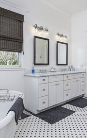 Kinsley 3 Light 22" Vanity in Brushed Nickel in a room setting