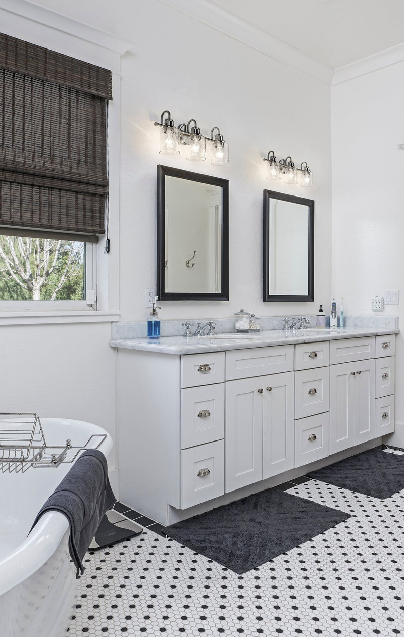Kinsley 3 Light 22" Vanity in Brushed Nickel in a room setting