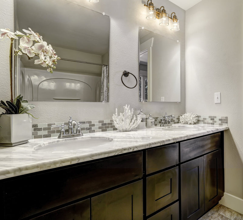Kinsley 3 Light 22" Vanity in Heirloom Gold in a room setting