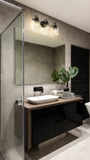 Kinsley 3 Light 22" Vanity in Matte Black in a room setting