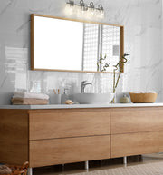 Kinsley 4 Light 28" Vanity in Brushed Nickel in a room setting