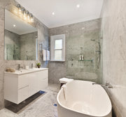 Kinsley 4 Light 28" Vanity in Chrome in a room setting