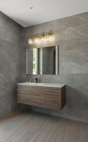 Kinsley 4 Light 28" Vanity in Heirloom Gold in a room setting