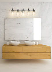 Kinsley 5 Light 35" Vanity in Chrome in a room setting