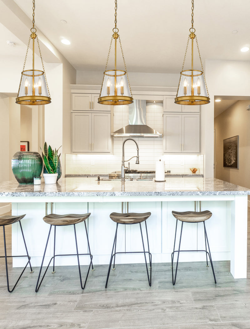 Prescott 3 Light 12" Pendant in Rubbed Brass in a room setting