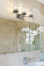 Archer 3 Light 25" Vanity in Brushed Nickel in a room setting