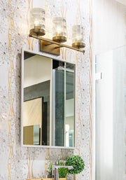 Archer 3 Light 25" Vanity in Heirloom Gold in a room setting