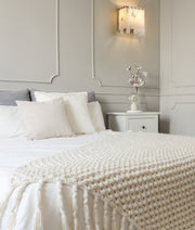 Viviana 2 Light 7.5" Wall Sconce in Rubbed Brass in a room setting