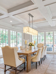 Viviana 7 Light 49" Linear Pendant in Polished Nickel in a room setting